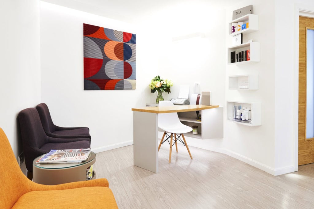 Bright and welcoming clinic reception with modern decor and comfortable seating.